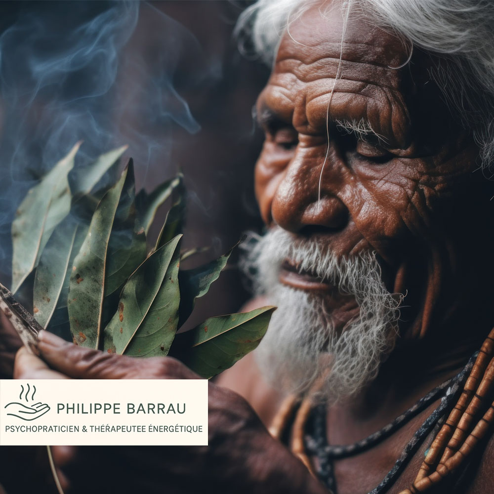 Portrait symbolique d’un chaman aborigène d’Australie tenant des feuilles médicinales, représentant la sagesse ancestrale et la pratique énergétique – Philippe Barrau, psychopraticien et thérapeute énergétique à Saint-Rémy-de-Provence.