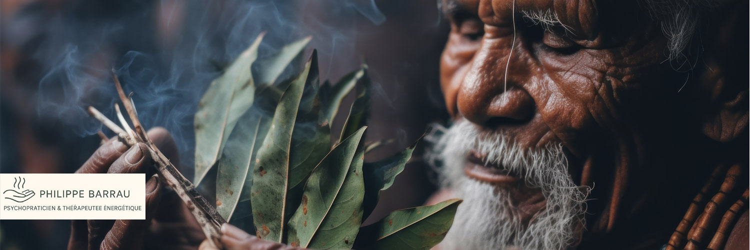 Bannière représentant un chaman aborigène d’Australie tenant des feuilles médicinales et de la fumée, symbole de sagesse, de soin et de connexion énergétique – Philippe Barrau, psychopraticien et thérapeute énergétique à Saint-Rémy-de-Provence
